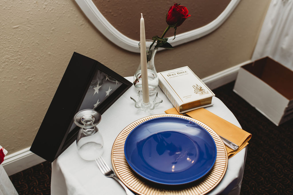 Place Setting at Empty Chair Display by Marilyn Bova
