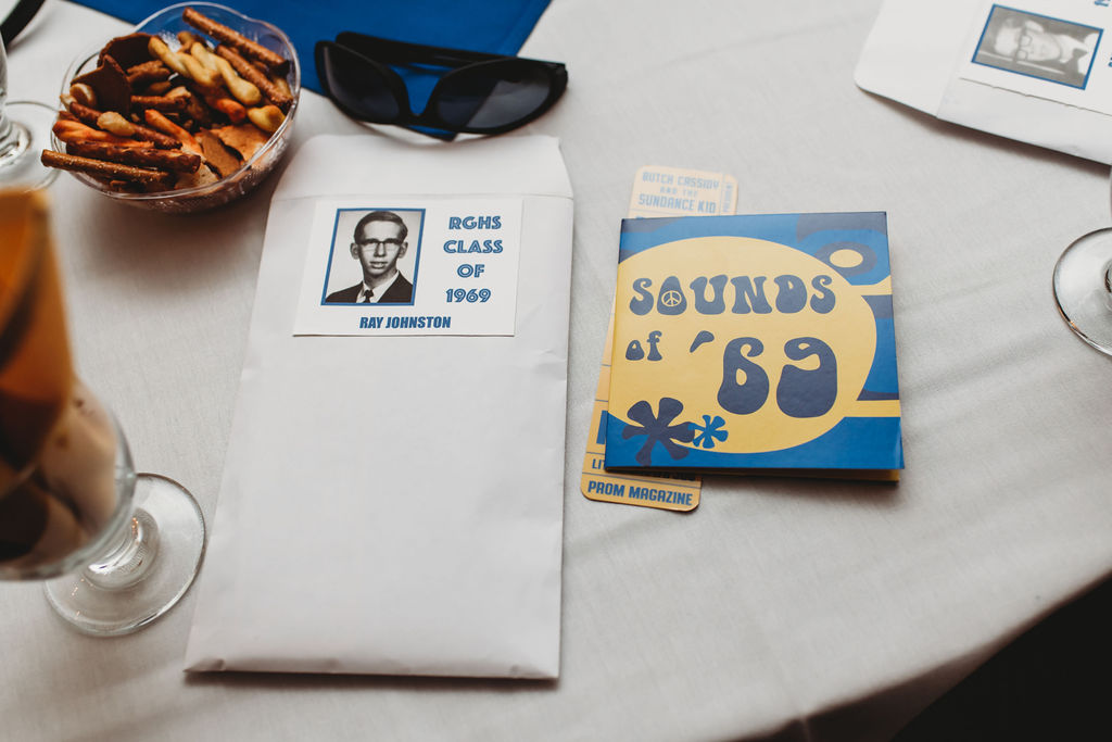 Reunion Packets: Ray Johnston and Dan Mattison (upper right corner) with Sounds of 69 CD Party Favor and Class of 69 Bookmark Party Favor (CD and Bookmark created by Dorothy Fey)
