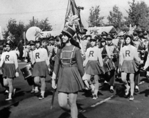 RGHS Marching Band: Fall 1968-Homecoming Parade; Barb Sampl (front/center) - Guidon Bearer; Class of 69 Flag Twirlers (from left) - Carolyn Amick, Connie Baumgart, Cheryl Krienkamp and Kathie Merinbaum