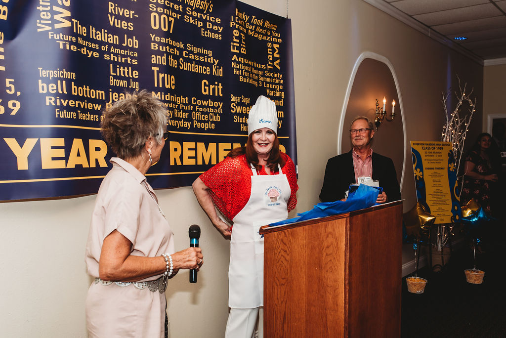 Runa and Dan presented Karen Clubb with a custom Chef's Hat and Apron in appreciation for making our Class Reunion Cupcakes!