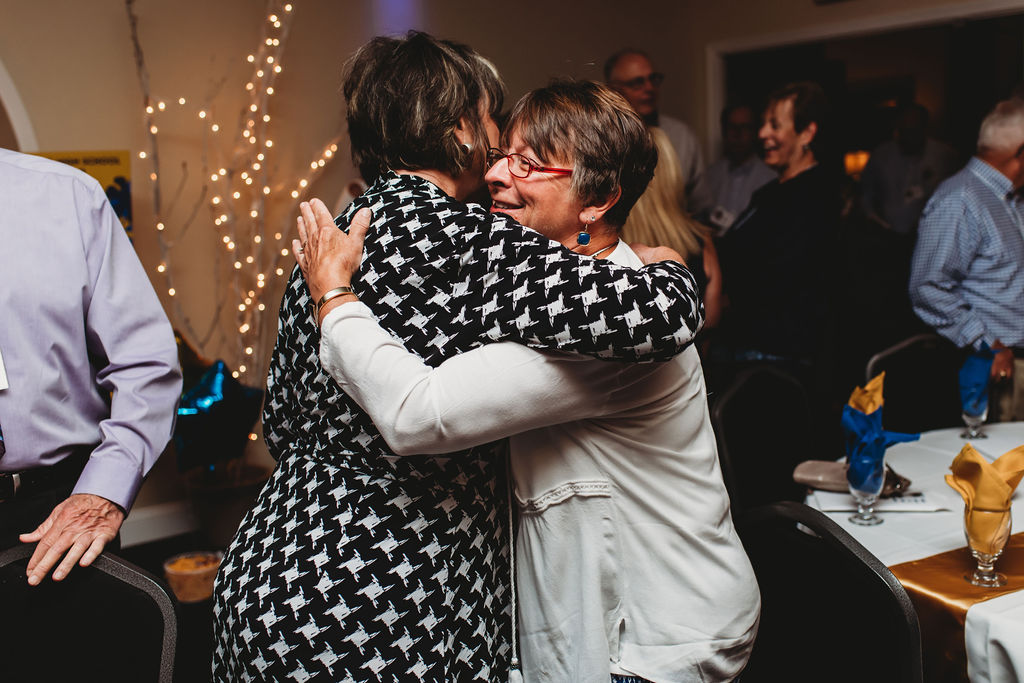 Lauran Kowalski and Roseann Post share a hug.